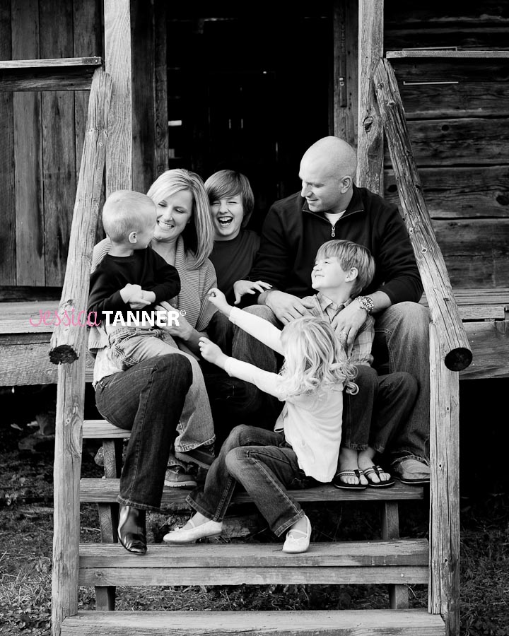 Family of 6 laughing on porch