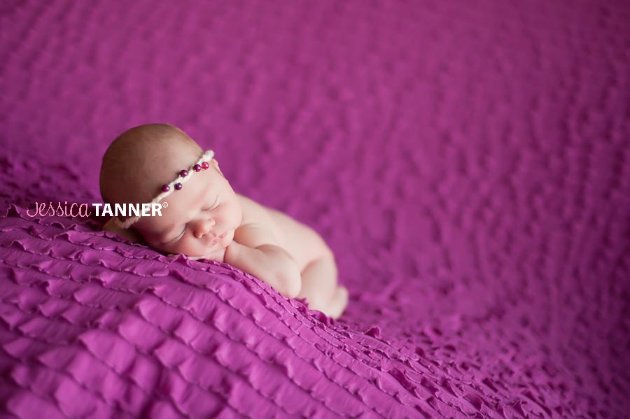 Newborn Baby Girl on a pink ruffled blanket